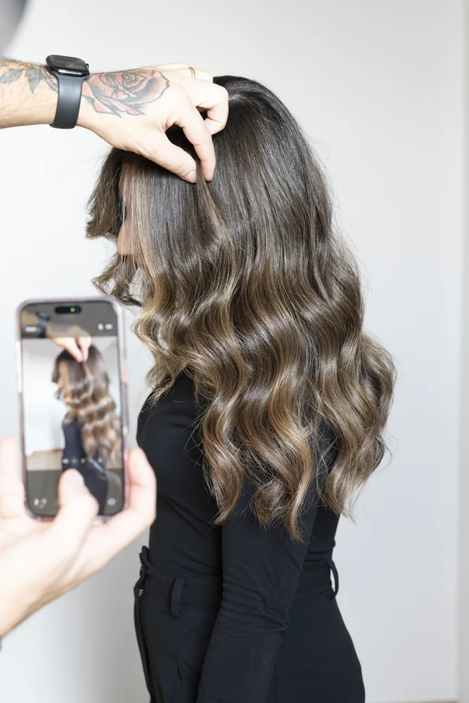 Finished brunette waves being styled